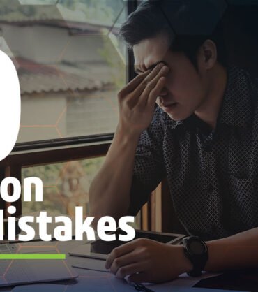 Two Senior Architectural Engineers Working With Building Blueprint on a Personal Computer. They Actively Discuss Various Plans and Schemes.